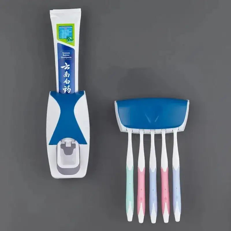 Toothbrush holder with automatic toothpaste dispenser in white and blue, holding a tube of toothpaste, designed for bathroom organization
